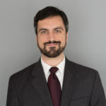 Professional man in suit with beard and tie.