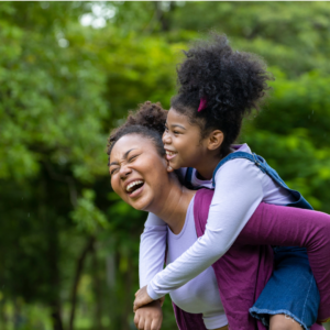 Mother and daughter in a park setting